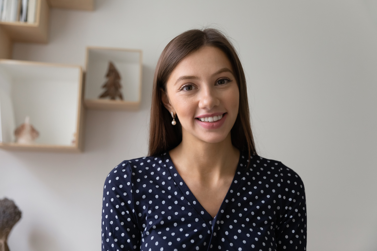 Profile portrait photo of young smiling beautiful woman.